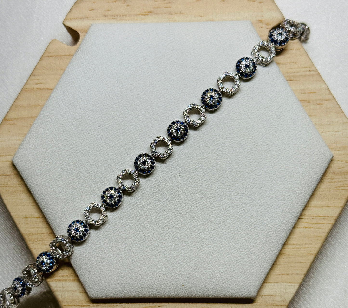 Evil eye tennis bracelet - Alternating eye and open flower design