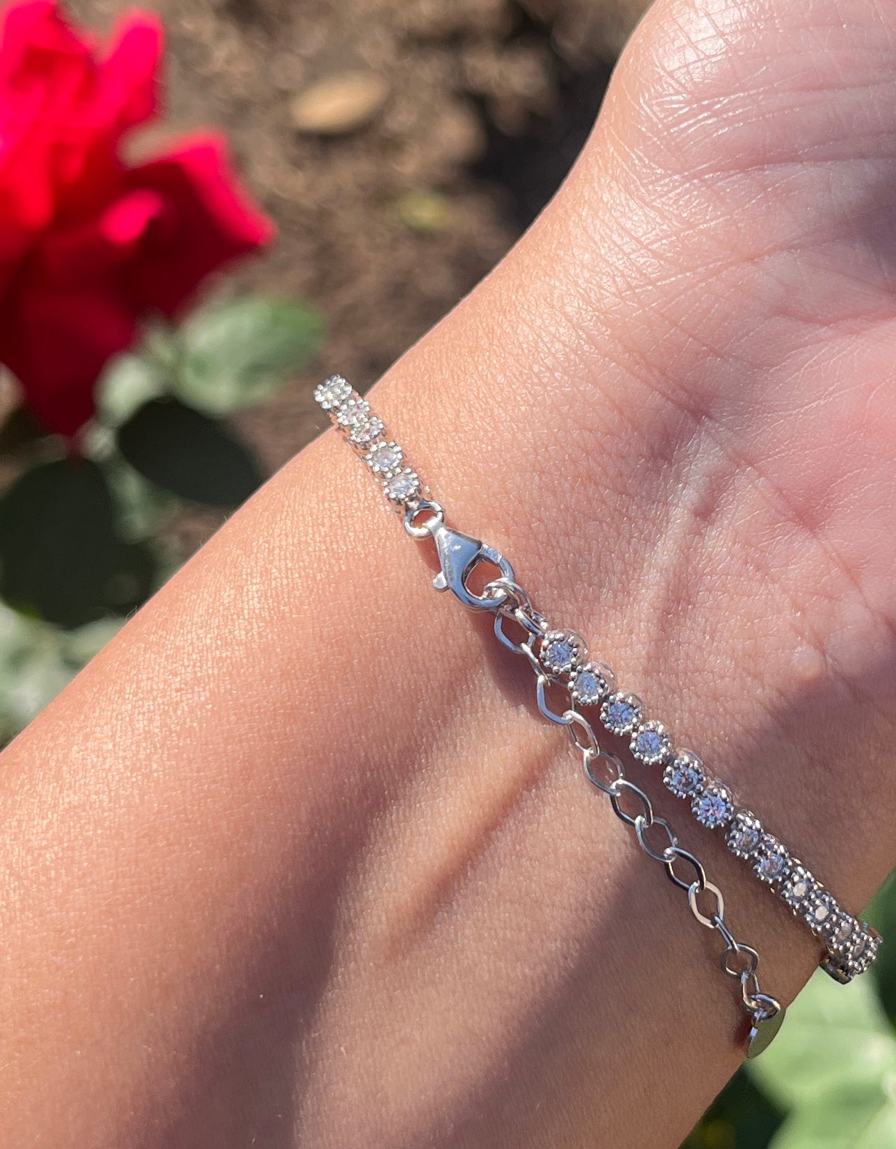 Tennis bracelet with rectangle design and green cz stones