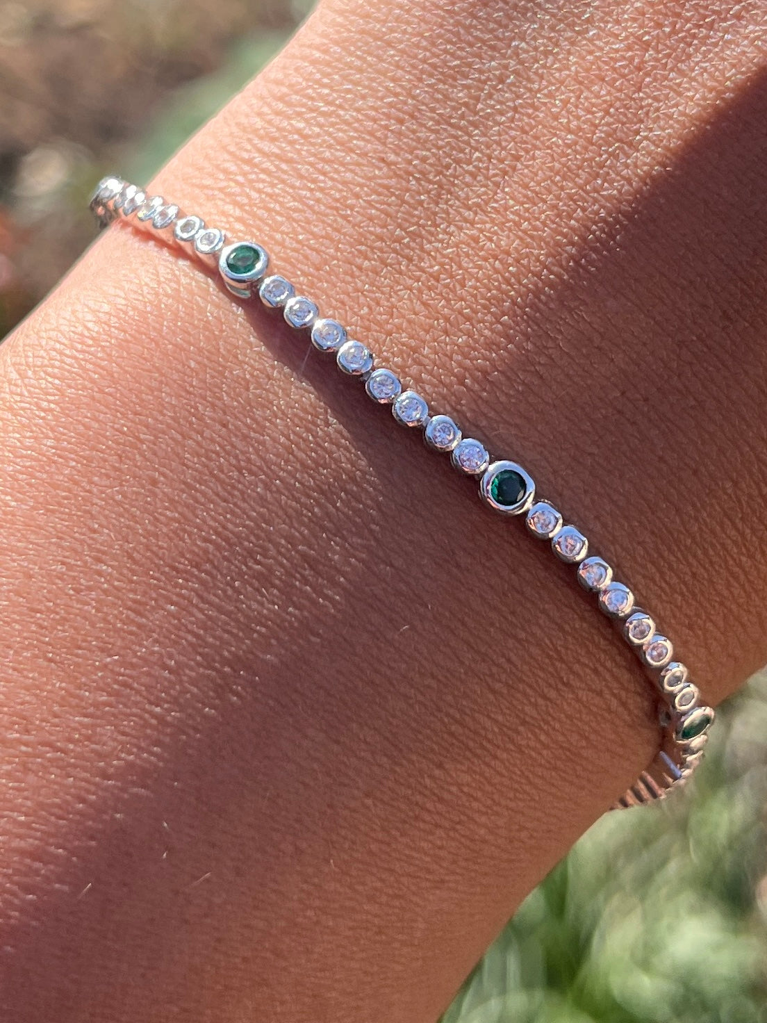 Round Tube Tennis Bracelet with a touch of green cz