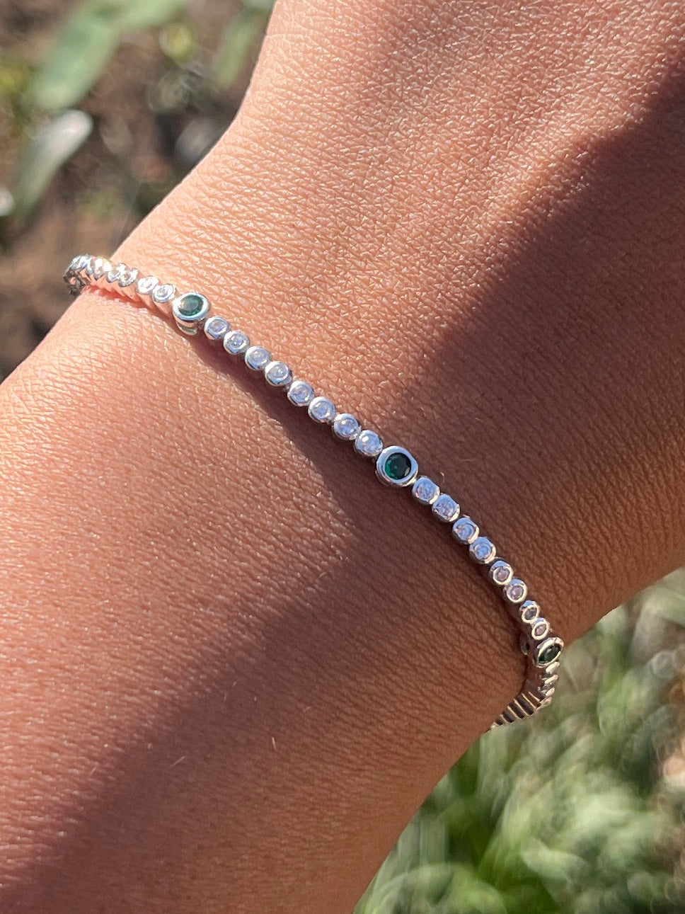 Round Tube Tennis Bracelet with a touch of green cz