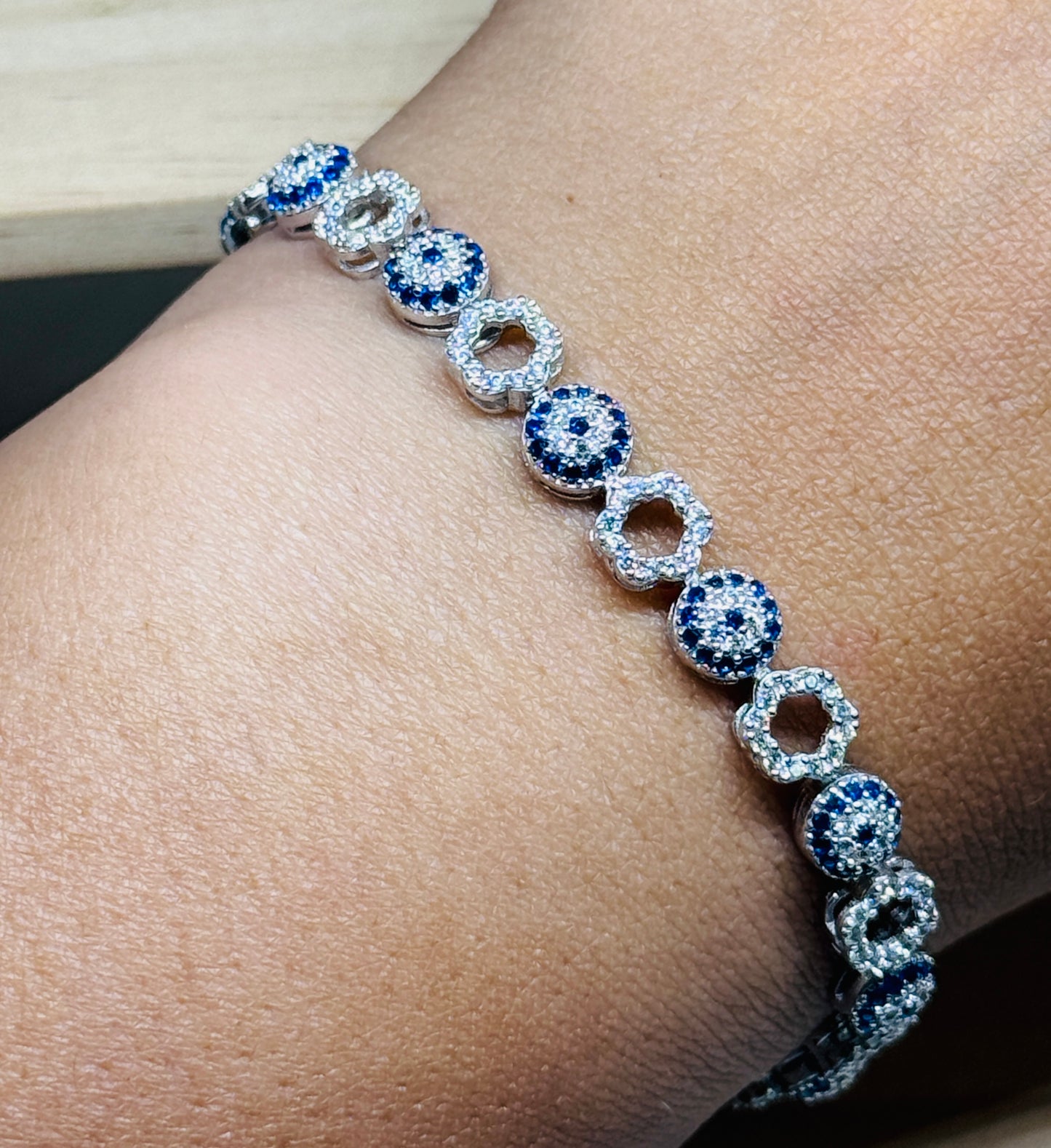 Evil eye tennis bracelet - Alternating eye and open flower design