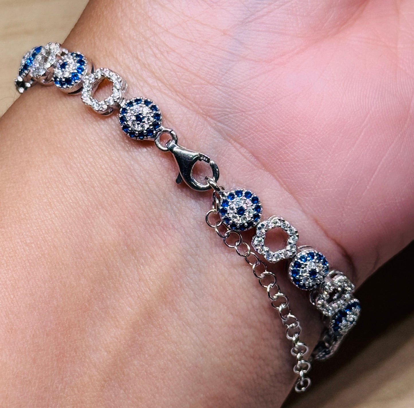 Evil eye tennis bracelet - Alternating eye and open flower design