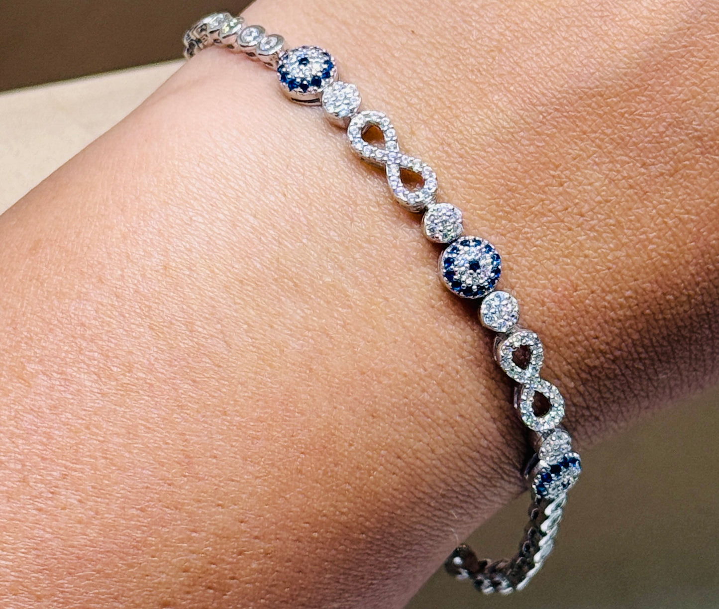 Evil eye tennis bracelet - with infinity design