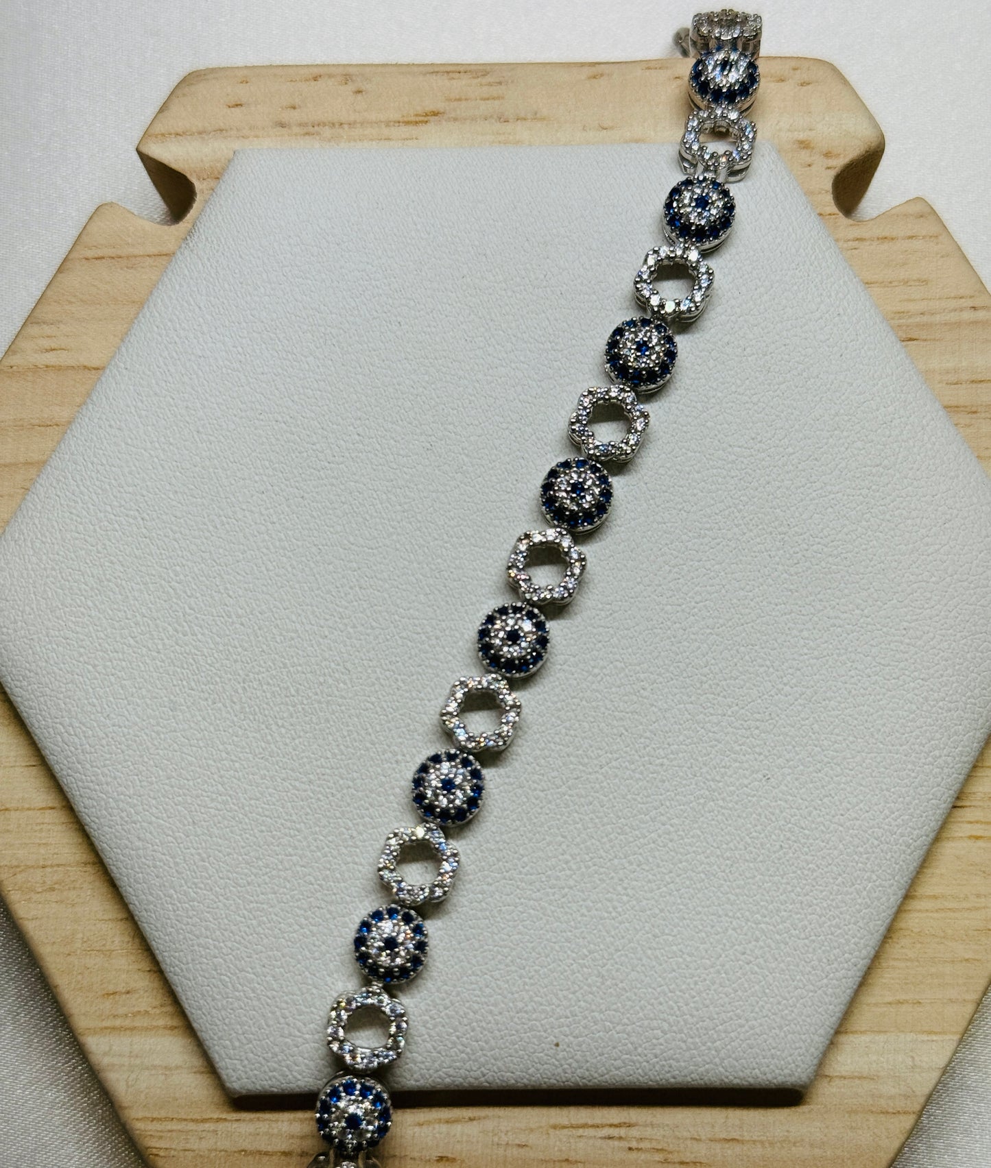 Evil eye tennis bracelet - Alternating eye and open flower design
